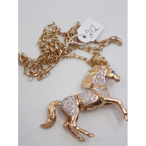 212 - A gold pendant and chain approx. 43 grams