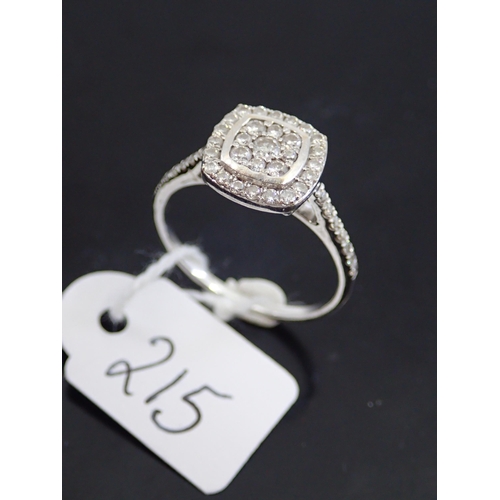 215 - A ladies 18ct white gold cluster diamond ring finger size P