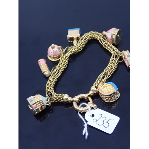 235 - An 18ct gold charm bracelet approx. 26.1 grams