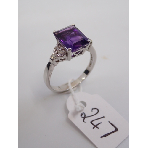 247 - A ladies 18ct white gold amethyst and diamond ring finger size P