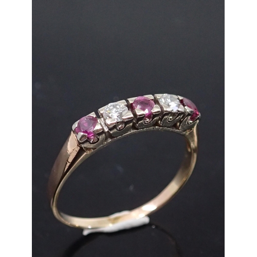 25 - A diamond and ruby set five stone ring, total estimated weight of diamonds 0.20cts and ruby 0.60cts ... 