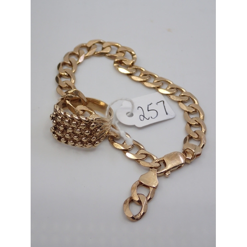 257 - A gents gold bracelet and ring, total weight approx. 27.7 grams