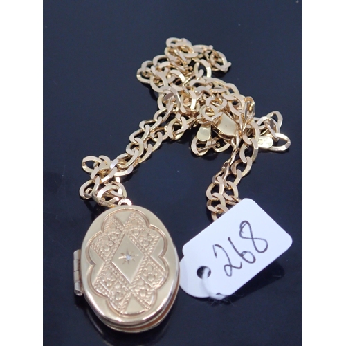 268 - A gold locket and chain, approx. 11.2 grams