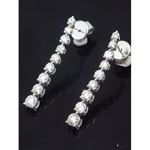 316 - A pair of diamond drop earrings, total estimated of diamonds 1.59cts set in 18ct gold