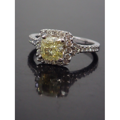 317 - A diamond cluster ring, set with a fancy yellow diamond, with a EDR report which states the diamond ... 