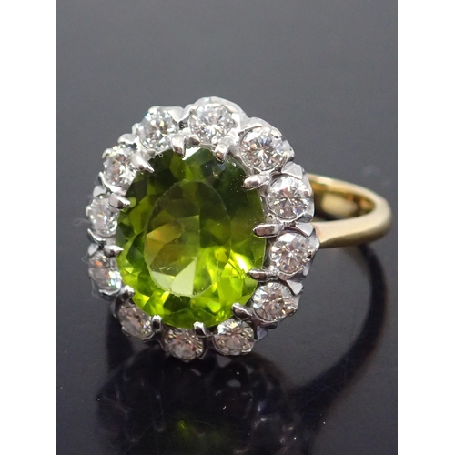 320 - A peridot and diamond cluster ring finger size P