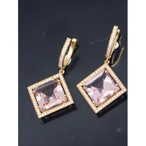 322 - A pair of morganite and diamond cluster earrings