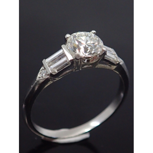 323 - A diamond solitaire ring set with diamond shoulders, estimated weight of main diamond 0.70cts I colo... 