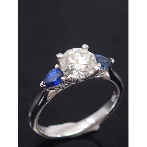 325 - A diamond ring set with sapphire shoulders, estimated weight of diamond 0.87cts H colour and Si1 cla... 