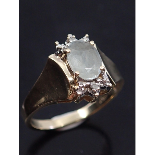 36 - A diamond and gem set cluster ring approx. 10kt approx. 2.5 grams