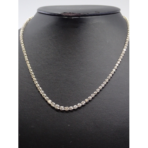 43 - A diamond line necklace set 14kt gold, it is about 17 inches and its total estimated weight of diamo... 