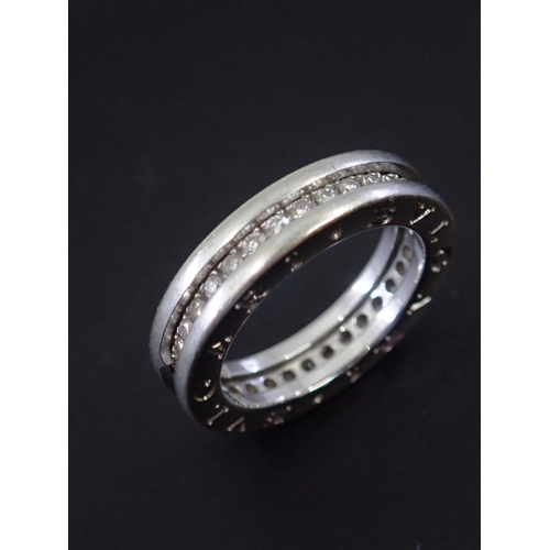 49 - A diamond set Bvlgari 18ct gold full eternity ring, finger size just a shade over K, hallmarked with... 