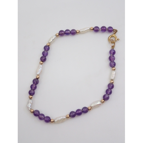 50 - A pearl and amethyst bracelet approx. 3.3 grams