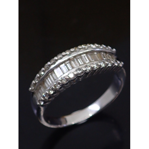 51 - A diamond half eternity ring set in 18ct gold finger size O