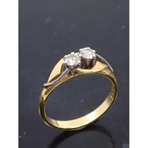 52 - A diamond two stone ring set in 18ct gold, approx. 3 grams finger size M