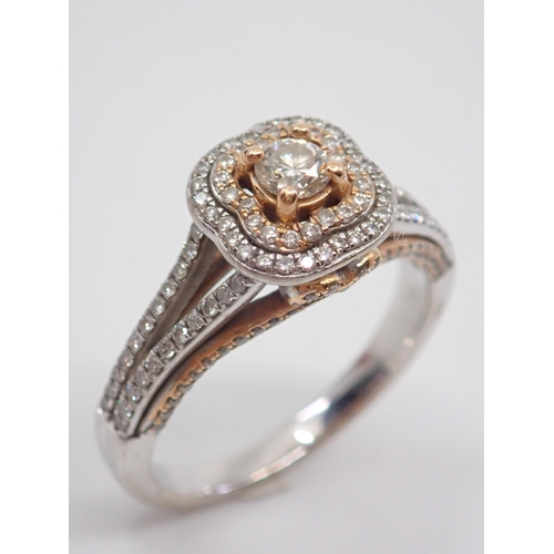 56 - A diamond cluster ring set in 18ct gold, with a copy of valuation which states the total diamond wei... 