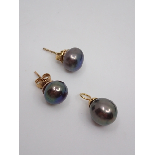 64 - Pearl set earrings and a pendant