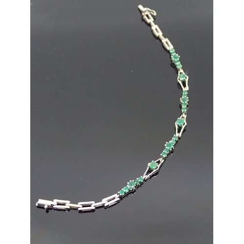 72 - An 18ct gold emerald set bracelet approx. 9.9 grams