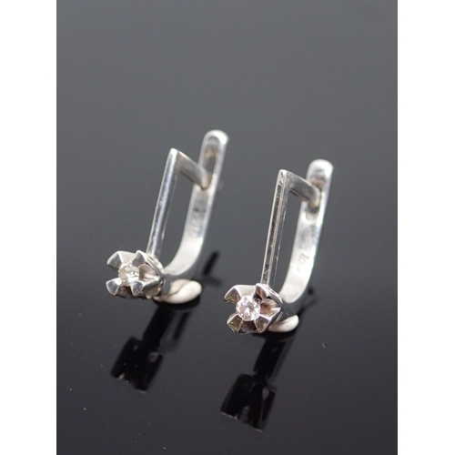 73 - A pair of diamond set 18ct gold earrings approx. 2.9 grams