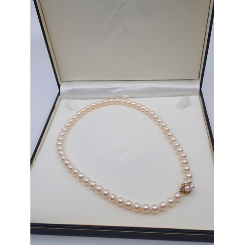 78 - A pearl necklace with a 9ct gold clasp