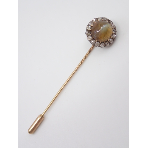 87 - A diamond and gem set stick pin approx. 3.1 grams