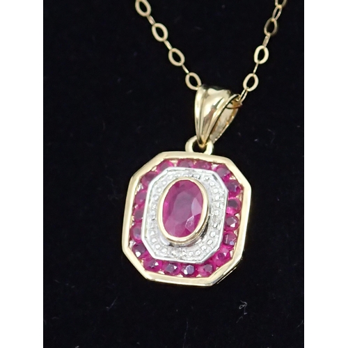 95 - A gold diamond and ruby pendant and chain