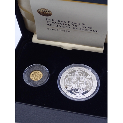 394 - A boxed set of a gold €20 coin and silver €10 coin.