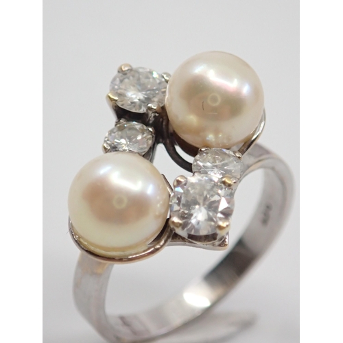 4 - A diamond and pearl set ring set in 9ct gold finger size R