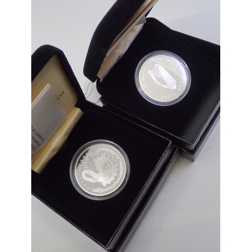 407 - An Irish €15 coin and an €10 coin in fitted boxes