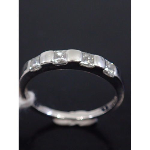 44 - A diamond half eternity ring, showing as finger size M