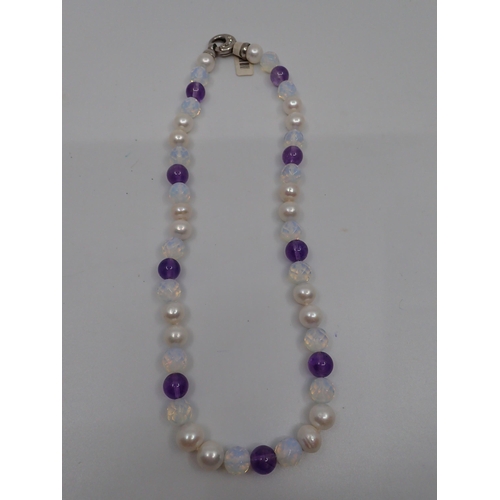 46 - A pearl and gem set necklace