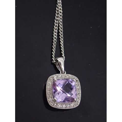 50 - A diamond and amethyst pendant and chain