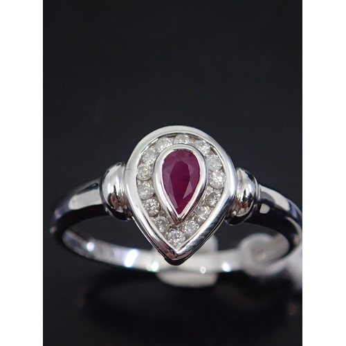 52 - A ruby and diamond ring, showing as finger size O