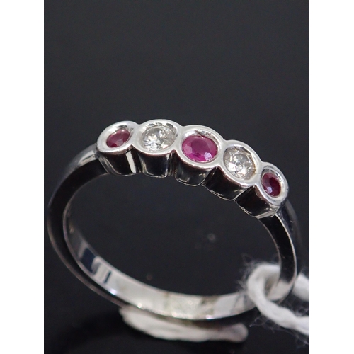 53 - A ruby and diamond ring five stone ring, showing as finger size M