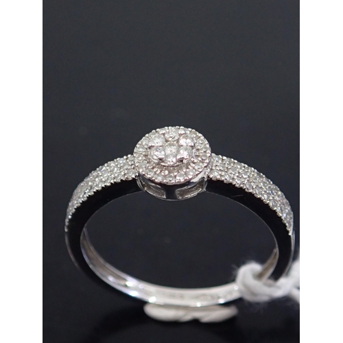 54 - A diamond cluster ring, showing as finger size O and a half