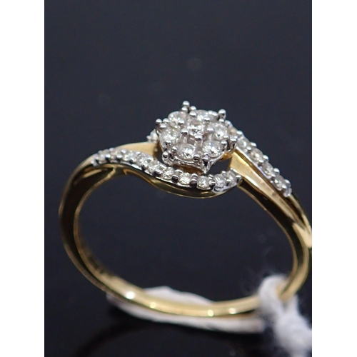 57 - A diamond cluster ring, showing as finger size M and a half