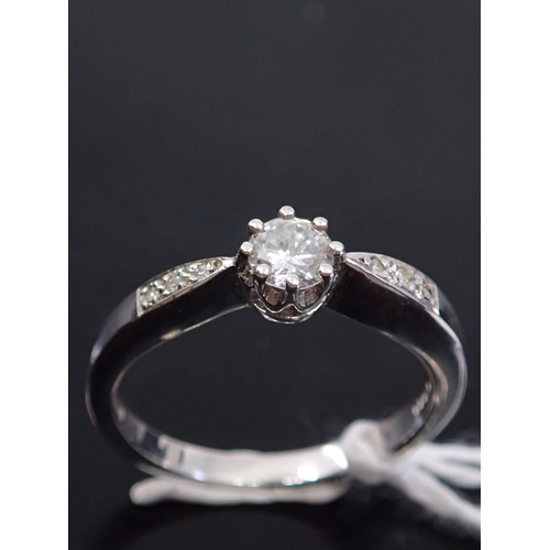 59 - A diamond solitaire ring, showing as finger size N