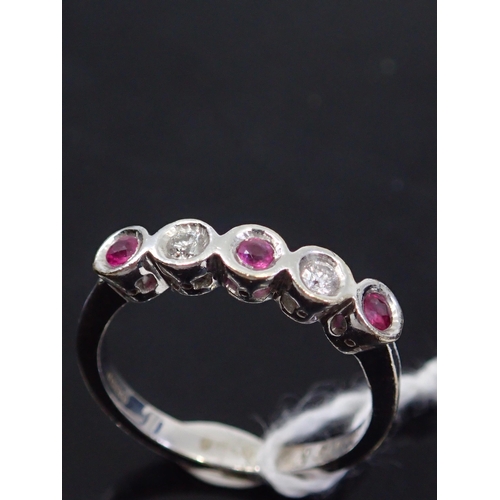 60 - A ruby and diamond 5 stone ring, showing as finger size M and a half