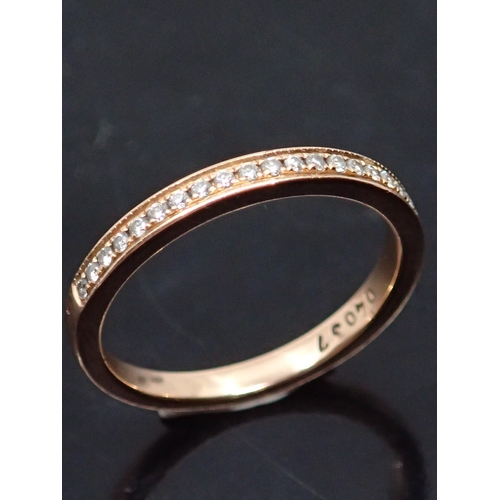 73 - A diamond half eternity ring set with a copy of valuation its valued at €650 finger size  K