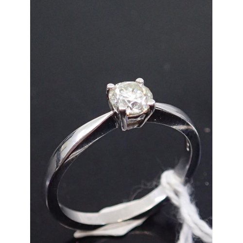 35 - A diamond solitaire ring set in 18ct gold finger size N