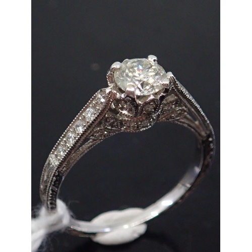 37 - A diamond solitaire ring set with diamond shoulders, total estimated weight of diamonds 0.85cts fing... 