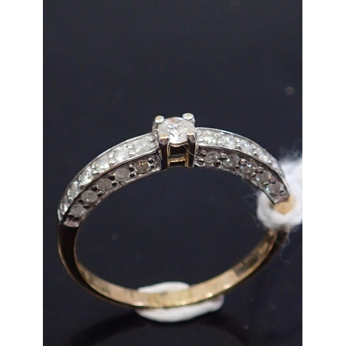 38 - A diamond solitaire ring set with diamond shoulders set in 9ct gold finger size N Half