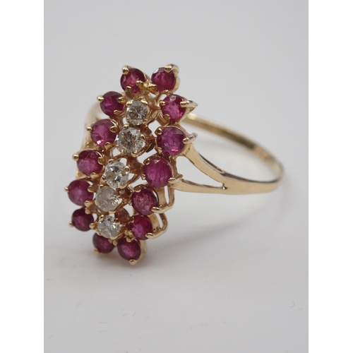 117 - A diamond and ruby cluster gold ring finger size U