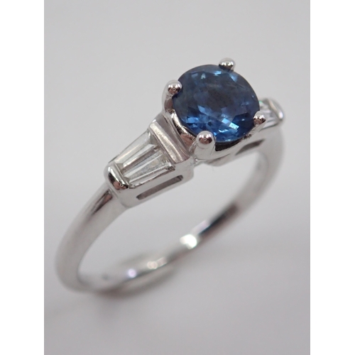 12 - A sapphire and diamond ring set in 18ct,  total estimated weight of diamonds 0.20cts finger size N