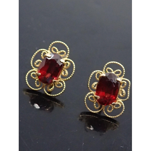 14 - A pair of gem set earrings