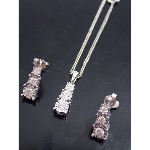 18 - A pair of diamond set earrings and diamond set pendant on chain