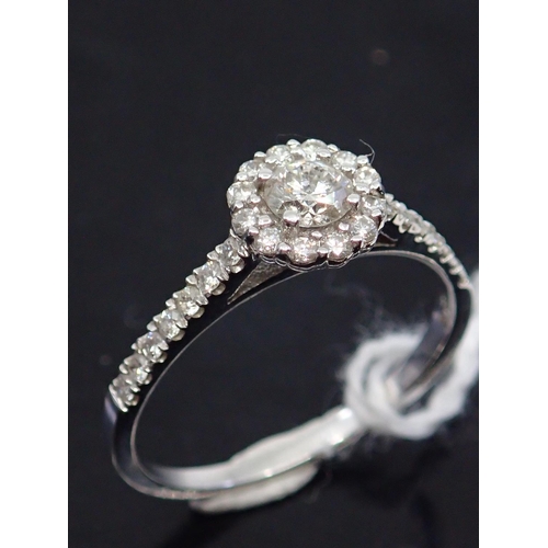 23 - A diamond cluster ring set in 14ct gold total estimated weight of diamonds 0.25cts, showing as finge... 