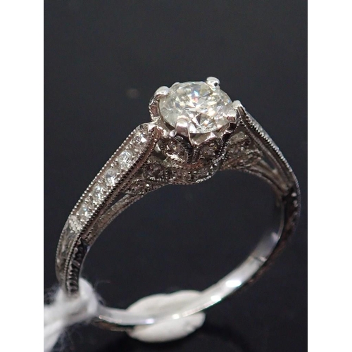 30 - A diamond solitaire ring set with diamond shoulders, total estimated weight of diamonds 0.85cts fing... 