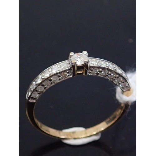 31 - A diamond solitaire ring set with diamond shoulders set in 9ct gold finger size N Half