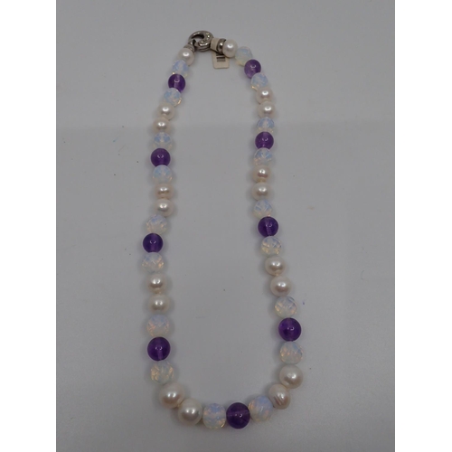 37 - A pearl and gem set necklace